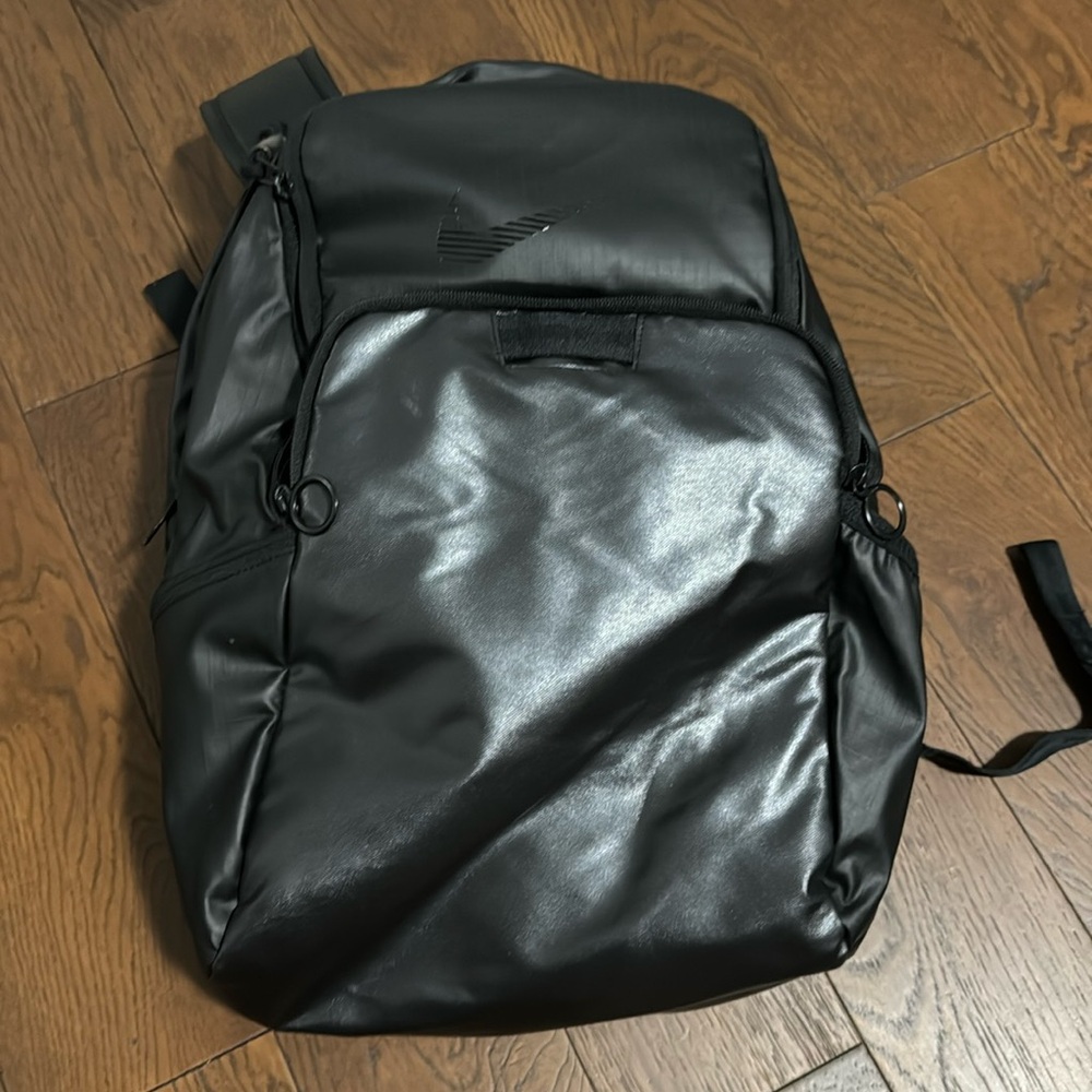NIKE. Black, leather backpack.
